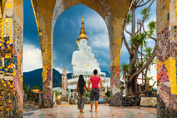 People travel in Thailand and enjoy the amazing Buddhist temple Wat Phra Thart Pha Sorn Kaew in...