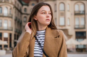 Fototapeta premium Beautiful young woman in winter clothes