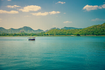Mesmerizing view of Fateh Sagar Lake situated in the city of Udaipur, Rajasthan, India. It is an artificial lake popular for boating among tourist who visits City of lakes to enjoy vacations.
