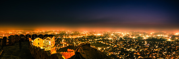 Fototapeta na wymiar Panoramic aerial view of Jaipur city also known as Pink city during twilight from Nahargarh Fort, Rajasthan, India.