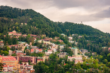 Fototapeta premium Beautiful panoramic cityscape of Shimla city from mall road, Shimla is the state capital of Himachal Pradesh located amidst Himalayas of India.