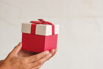 Hands delivering gifts isolated on background