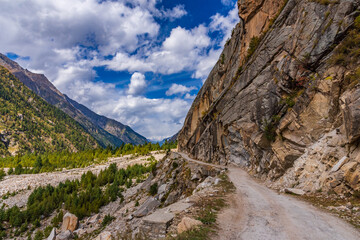 Fototapeta na wymiar View from hilly mountain road travelling through Himalayas mountains near Chitkul, Kalpa Kinnaur, Himachal Pradesh, India.