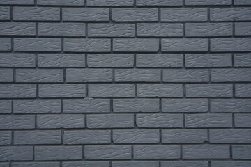 gray brick wall background texture pattern with symmetrical even bricks