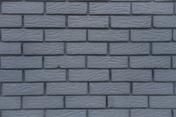 gray brick wall background texture pattern with symmetrical even bricks