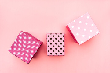 Fototapeta premium Gift boxs on paste pink background. Christmas and holiday minimal concept idea.