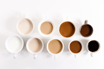 Obraz na płótnie Canvas cups of coffee on white background with color gradient of coffee
