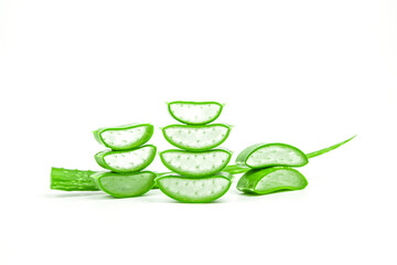 Slices of fresh aloe vera plant stacked and aloe vera stalk or leaves with water dropping isolate on white background.