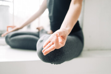 Hand in mudra position. Yoga practice detail - obrazy, fototapety, plakaty