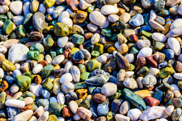 Texture of pebbles at the seaside. Natural background