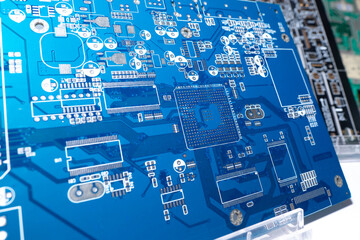 Blank motherboard for a computer. Blue circuit board close up. Motherboard computer board without...