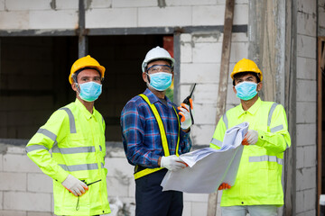 team construction worker control in the house structure at construction site, during the spread of coronavirus