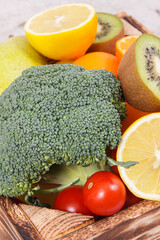 Fruits with vegetables in rustic box as food containing healthy minerals and vitamins, diet and slimming concept