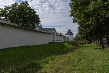 Fototapeta na wymiar St. Michael Cathedral and Taylovskaya Tower with fortress wall of Holy Dormition Pskovo-Pechersky Monastery. Pechory, Russia