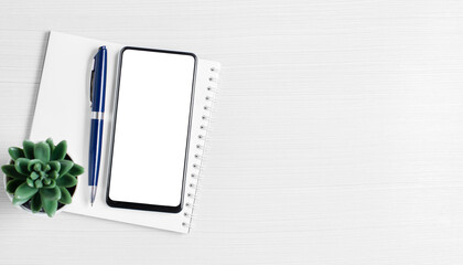 A smartphone with a blank screen on a white background. The concept of an online application for business or investment. Copy space