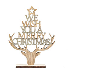 s Wooden craft Christmas decor with We wish you a merry Christmas sign isolated on white bckground
