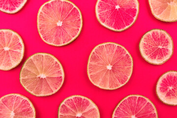 Lime slices on pink background