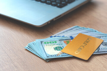 Blurred photo. Shopping card with  money, dollars and notebook.