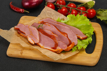 Sliced smoked duck breast served salad