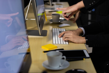 Businessman hand working at night on computer.
