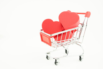 grocery cart and hearts inside, the concept of love by calculation