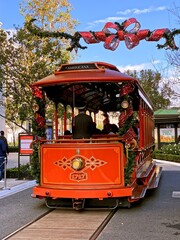 Obraz premium Vintage red tram with driver and passengers