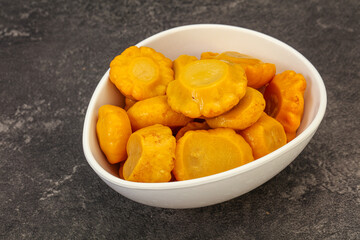 Marinated yellow patisson in the bowl