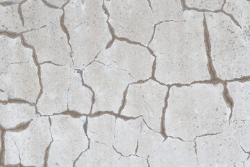 Background image of a gray wall with cracks.