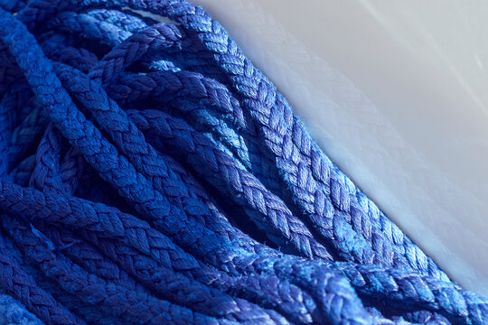 Yachting ropes or lines in pile, blue color texture, synthetic fibres