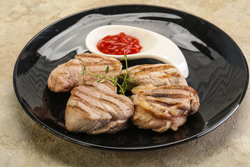 Grilled pork tenderlion with tomato sauce