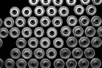 Black and white image of 
conveyor wheels, o-ring driven rollers and pulleys.