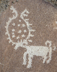 Deer carving on rock: ancient silk road petroglyph above Langar village in the Wakhan Corridor, Gorno-Badakshan, Tajikistan Pamir