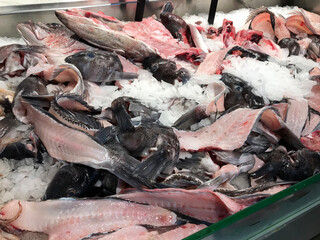Zero food waste concept, Close up of fresh fish scraps on ice.