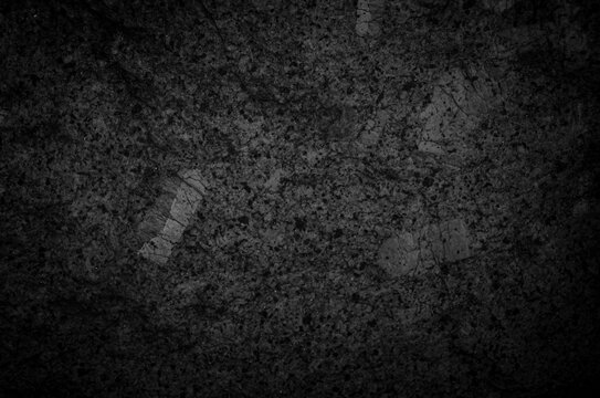 Dark tone granite surface. Intrusive igneous rock.