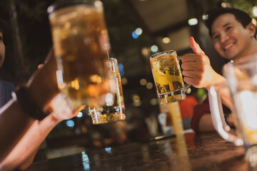 Asian friends Drinking beer outdoors at the brewery for the New Year festival