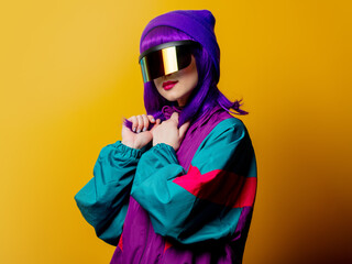 Style woman in VR glasses and 80s tracksuit