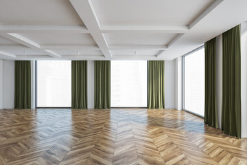 Large empty hall with parquet floor and windows with green curtains