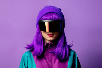Style woman in VR glasses and 80s tracksuit on violet background