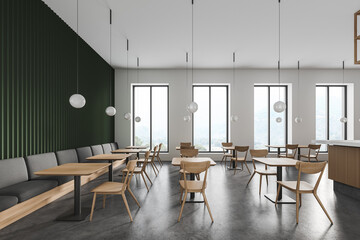 Green and white restaurant interior with sofa