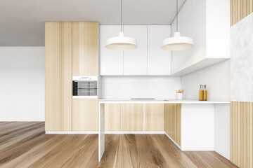 Light wooden kitchen set in modern apartment on parquet floor