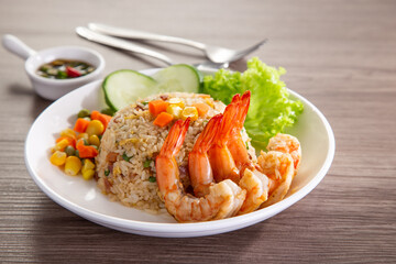 chinese fried rice with barbecue prawn on wooden table