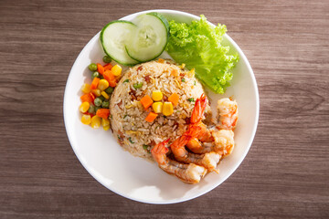 chinese fried rice with barbecue prawn on wooden table