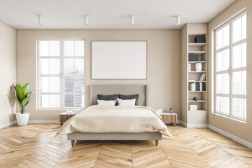 Wooden bedroom and canvas over bed with linens, beige walls and window