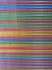 striped pattern of horizontal coloful plastic straws 