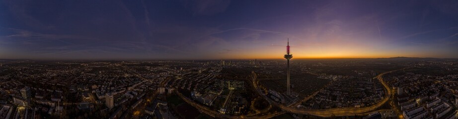 Fototapeta premium Drone image of the Frankfurt skyline with television tower in the evening during a colorful and impressive sunset
