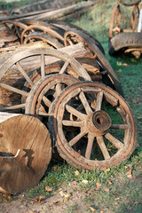 old rare wheels from a cart in the village, morning