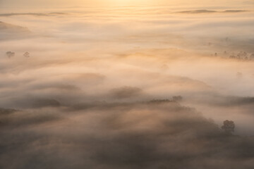 Fototapeta na wymiar Morning fog over the mountain valley at Khao Na Nai Luang Dharma Park, Surat Thani province, Thailand