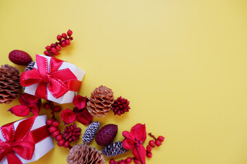 Christmas decoration and gift boxes on yellow background.
Colorful decoration for holiday.