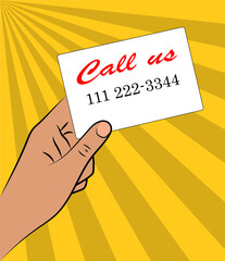 Hand holding business card on yellow background