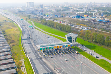 Top view aerial overloaded toll road or tollway on the controlled access highway, forced traffic jam.